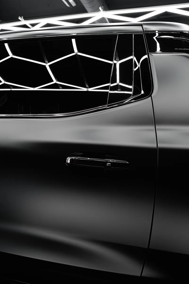Door and handle on a satin black Chevrolet pickup