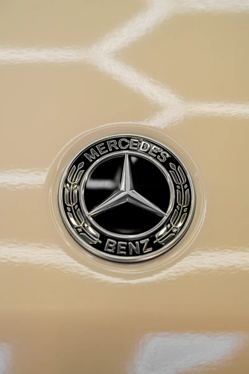 Mercedes-Benz emblem on the beige hood of a G63
