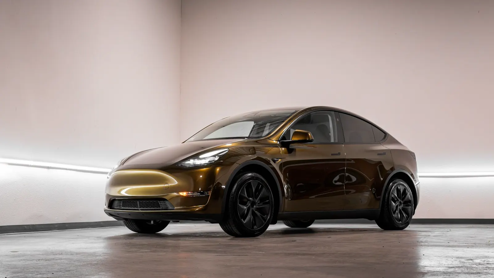 Tesla Model Y in a gloss bronze color change wrap