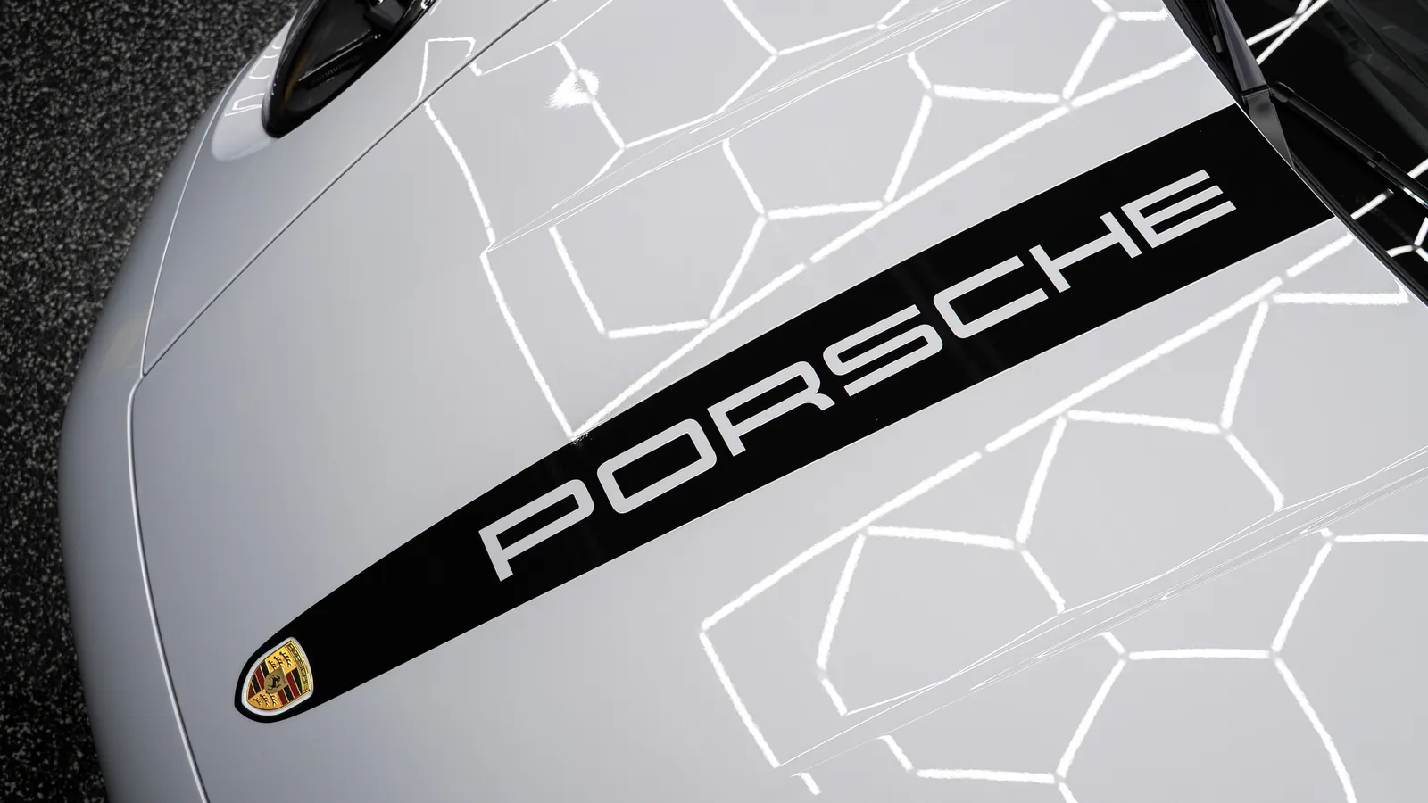 Hood of a white Porsche 911 Carrera GTS